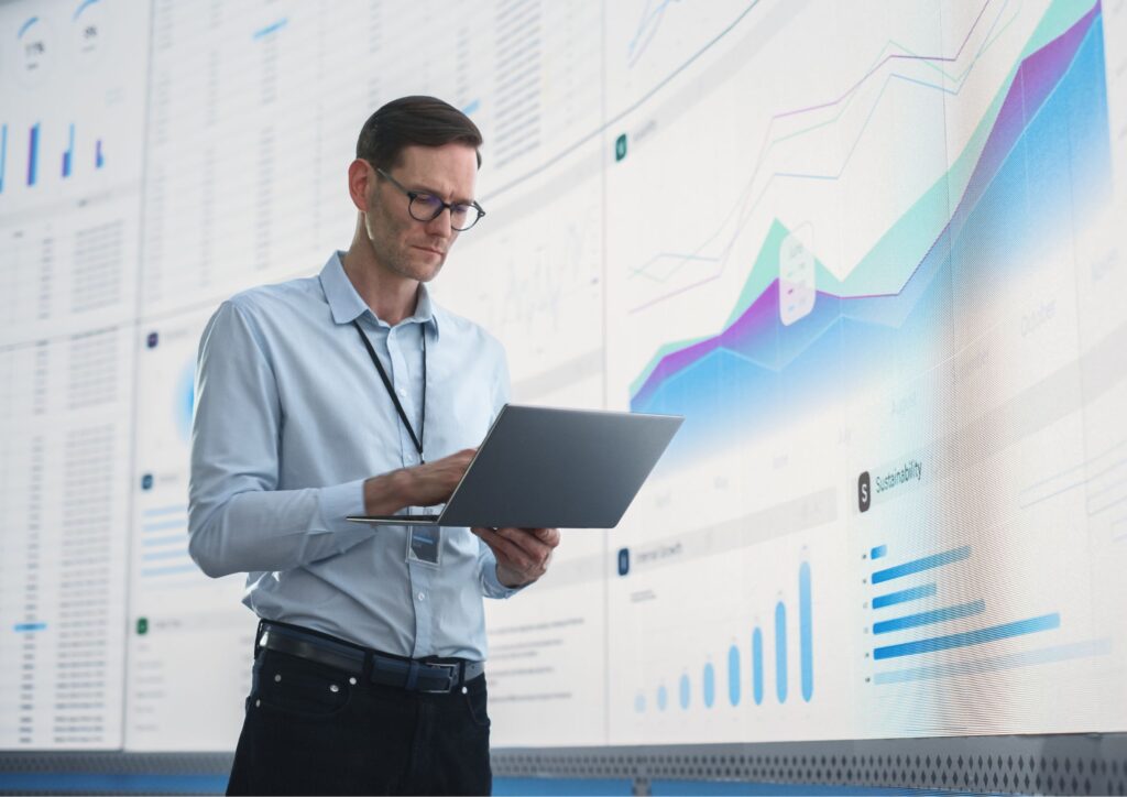 Image of a business man using a financial management system on his computer