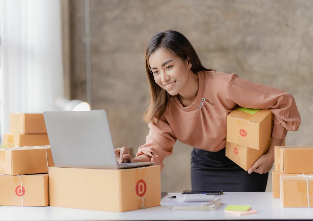 Image of a woman using a POS system to track inventory