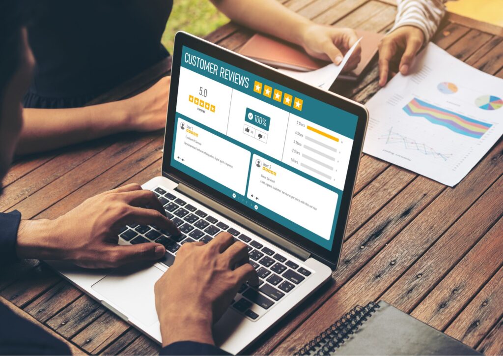 Image of someone on a computer checking the reviews of a small business