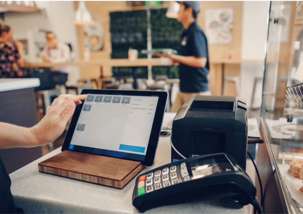 Image of a cashier setting up the POS software in the store