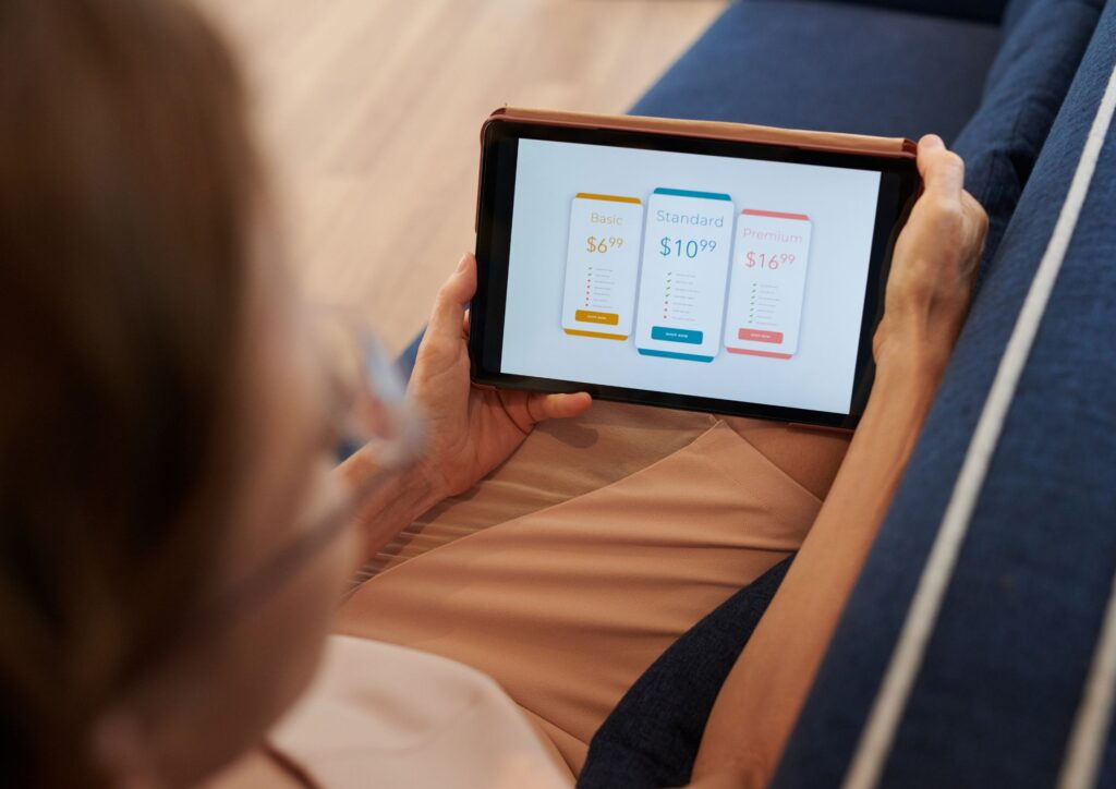 Image of a woman deciding between three different subscription plans for billing