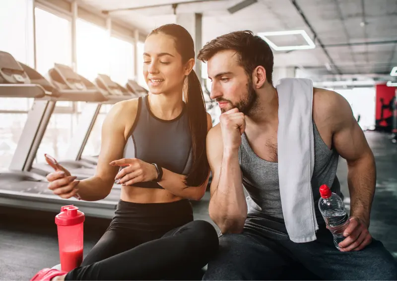 Image of two gym members using the top gym software