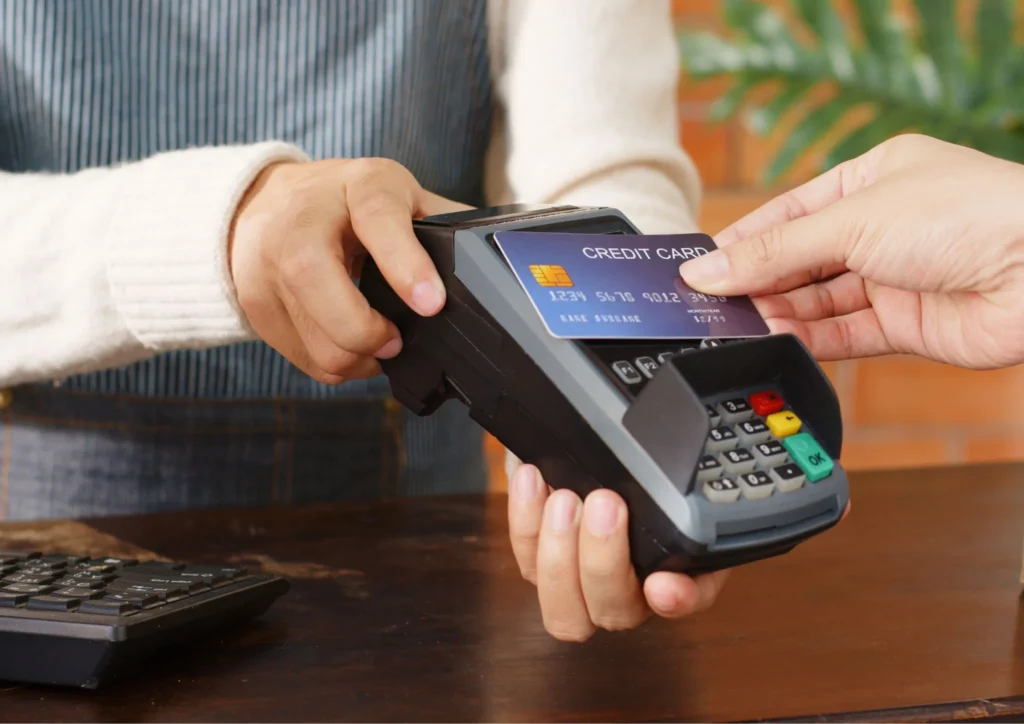 Image of a customer making a card payment with a credit card reader
