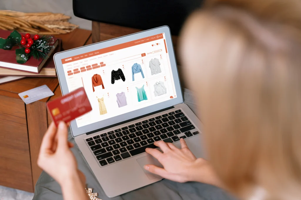 Image of a woman entering her credit card information on an online shop