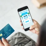 Image of a woman paying for a subscription plan on her mobile device