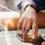 Image of a man making an ACH or credit card payment from his mobile device