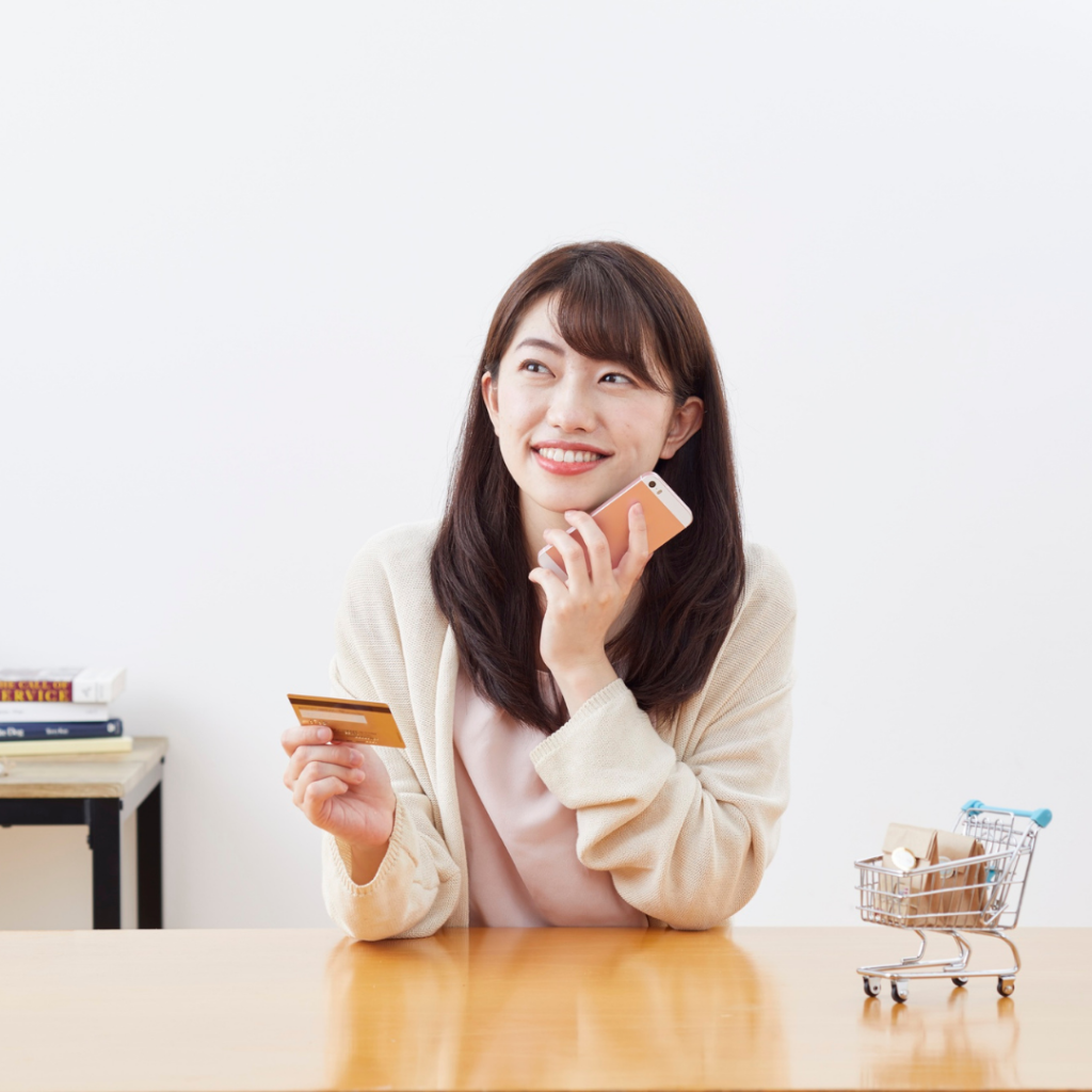 Image of a woman processing a credit card payment
