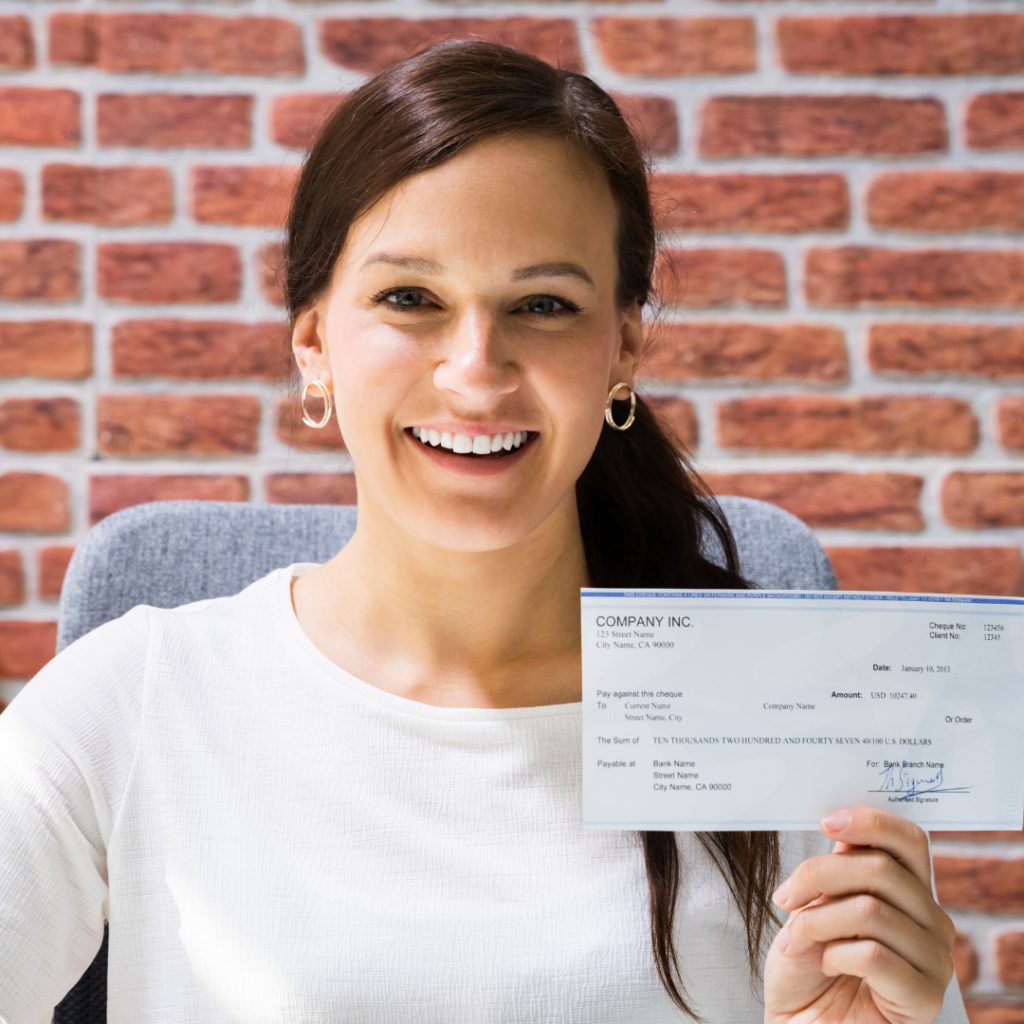 Image of an employee showing their payroll cards